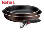 Two brown frying pans with a detachable black handle featuring a red button.