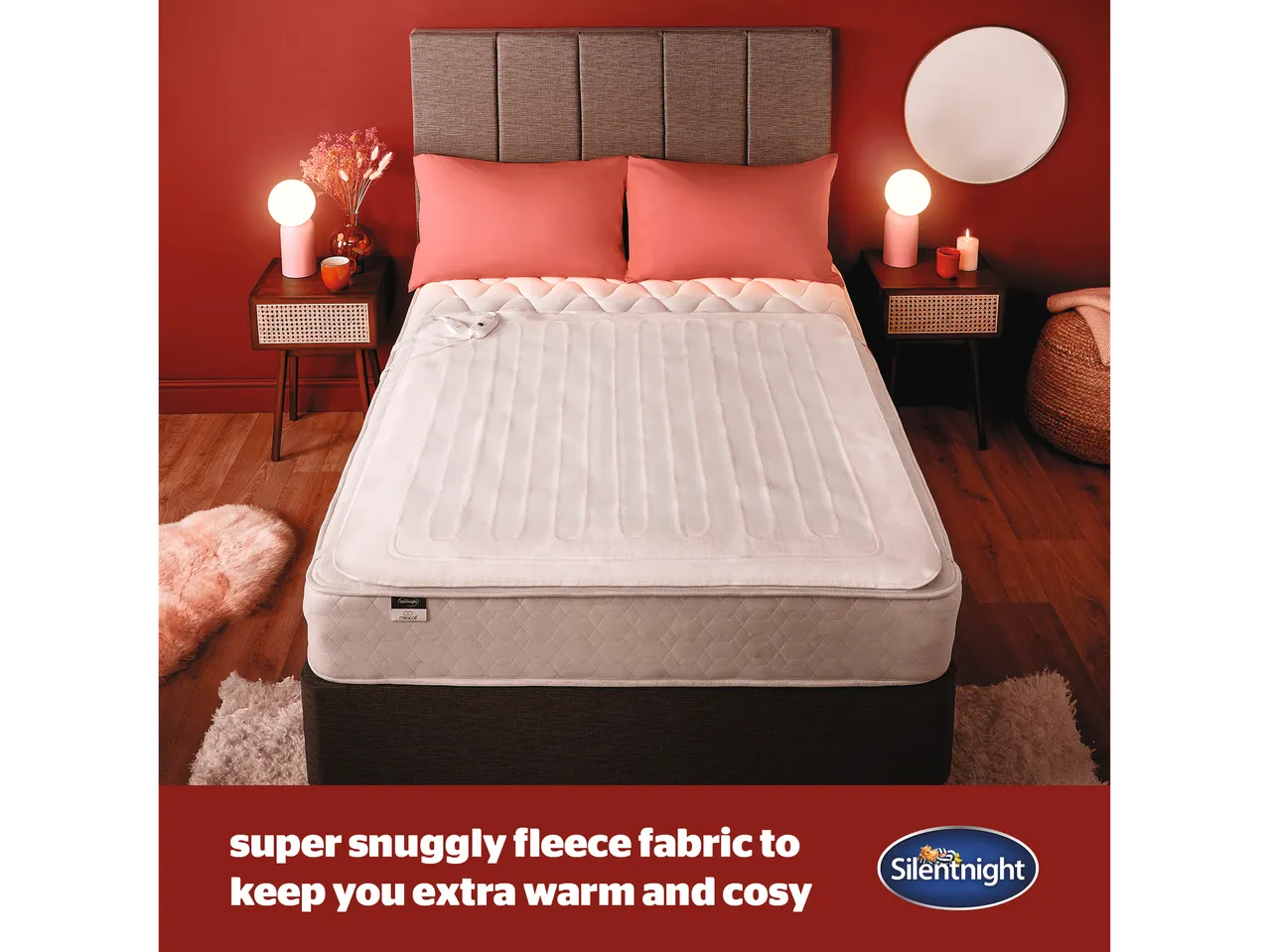 A Silentnight heated underblanket with super snuggly fleece fabric is shown on a bed in a cozy bedroom setting.