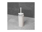 White toilet brush and holder with a woven texture, standing on a tiled floor.