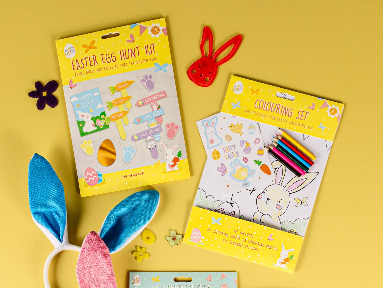Easter egg hunt kit, colouring set with pencils and stickers, and bunny ears.