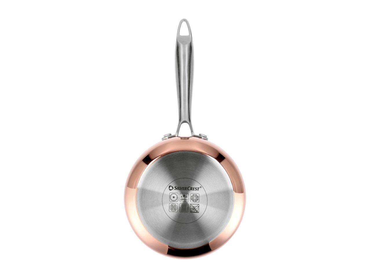 Underside of a copper-colored frying pan with a silver handle and induction base