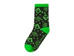 Black socks with green pixelated creeper faces and green accents on the cuff and toe.
