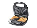 Open sandwich maker with two toasted sandwiches inside.