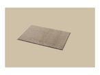 A rectangular beige bath mat with a shaggy texture on a light beige background.