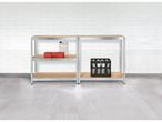 Two metal shelving units with wooden shelves hold various items, including a toolbox, plastic bottles, and a crate of water bottles.