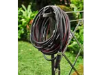 Parkside Performance® 20m Garden Hose Set, coiled on a stand in a garden.