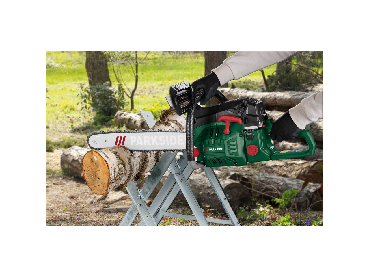 Person using a Parkside chainsaw to cut a log on a sawhorse.