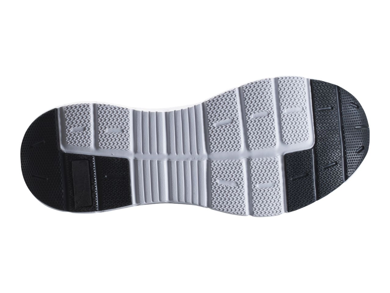 Bottom view of a black and white shoe sole with a textured pattern for grip.