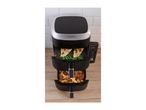 Dual-basket air fryer with chicken breast, green beans, chicken wings, and fries.
