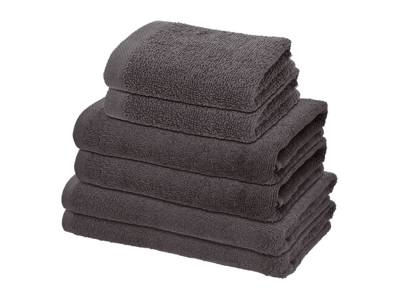 Stack of dark grey bath towels, hand towels, and washcloths.