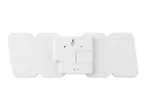 Rear view of a white digital clock with battery compartment and hanging holes.