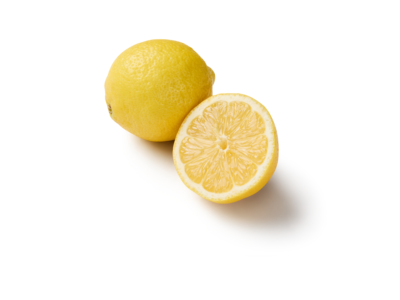 One whole lemon and one half lemon, cut open to show the pulp.