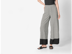 Pantaloni eleganți, largi, cu imprimeu și tiv negru