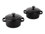 Two black ceramic mini casserole dishes with lids and handles.
