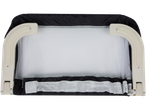 A white and black baby bed rail with safety warnings in multiple languages.