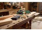 Parkside® electric planer and jigsaw on a workbench with chisels and wood.