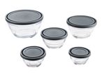 A set of five glass bowls with dark gray lids.