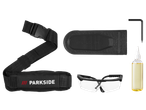 Shoulder strap, chain guard, safety glasses, oil bottle, and hex key for a power tool.