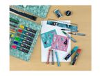 An art set with colored pencils, markers, stencils, and a ruler on a wooden table.