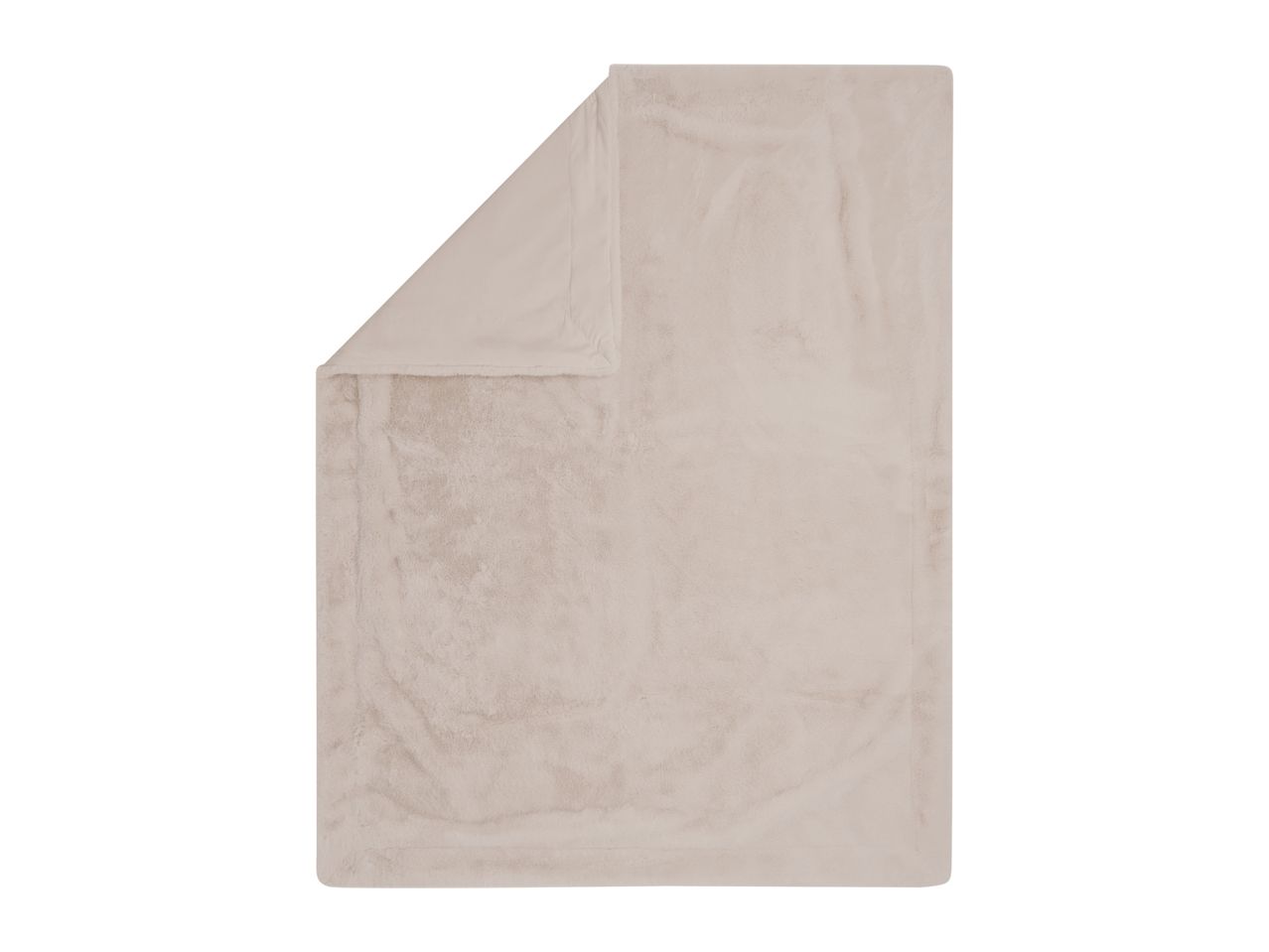 Soft beige faux fur blanket with a folded corner