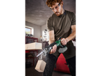 Man using a Parkside reciprocating saw to cut wood.