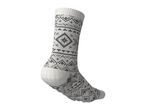 A single white sock with a black and brown fair isle pattern and non-slip grips on the sole