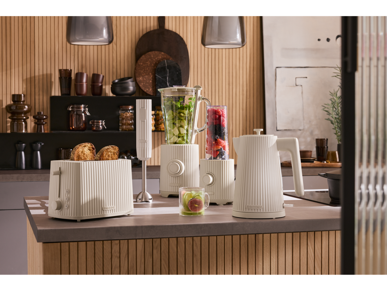 SILVERCREST® 800W Toaster, blender, and kettle in a modern kitchen setting.