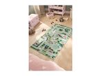 A children's play rug with a road and town design, surrounded by toys and storage.