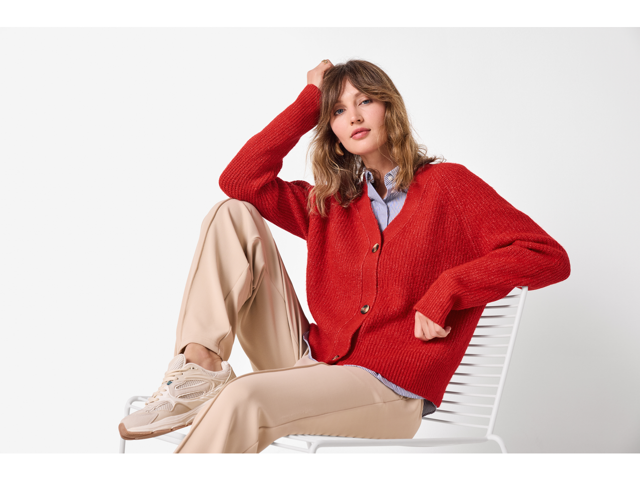 esmara® Ladies' Chunky Knit Cardigan in red, worn by a woman with beige trousers