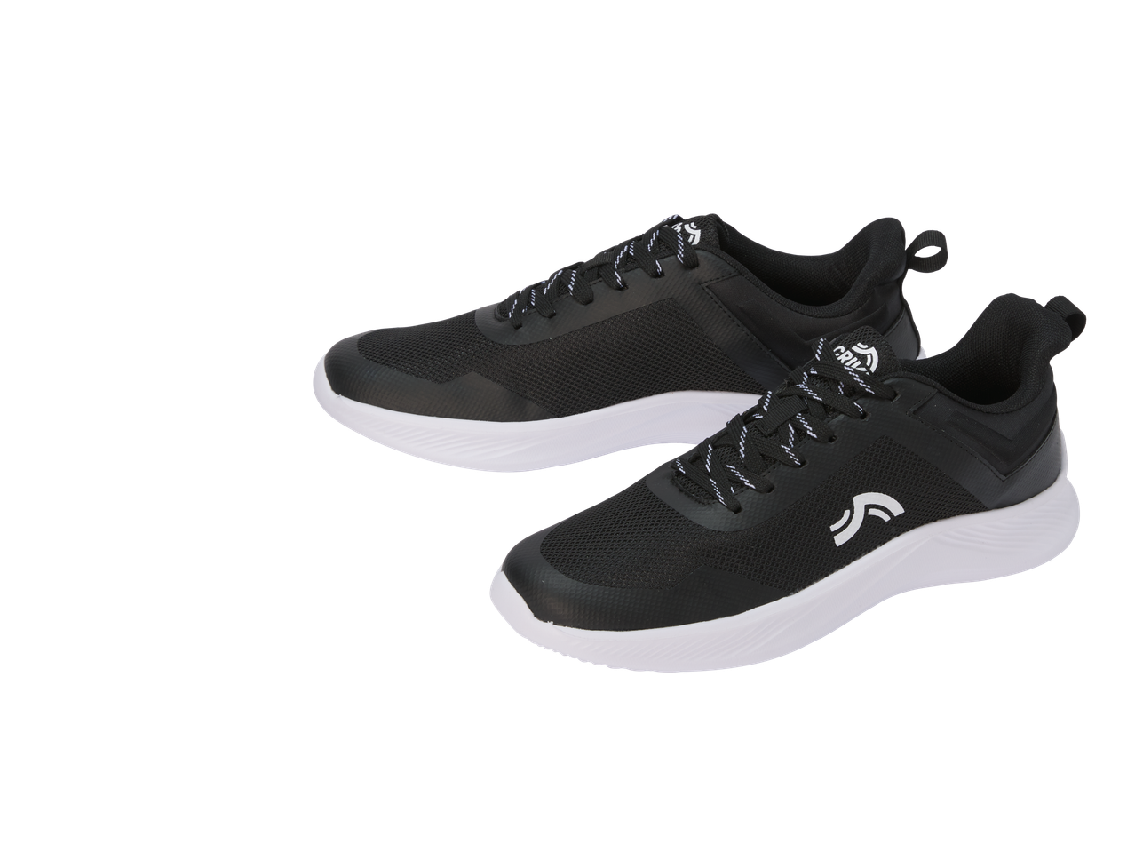 Melni Crivit sporta apavi ar baltām zolēm un baltām auklām, novietoti uz melna fona.