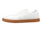 White leather sneaker with a brown sole.