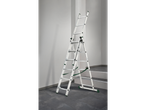 A silver PARKSIDE multi-purpose ladder stands on a dark tiled floor against a white wall.