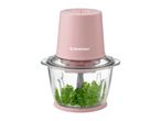 Pink food chopper with a glass bowl filled with parsley.
