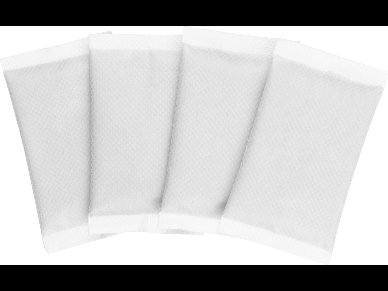 Neli valget tekstuurse pinnaga soojapakki.