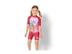 Girl in a pink and red short-sleeved rash guard and matching shorts with paw prints.