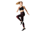 Woman in black sports bra, patterned leggings, and black sneakers mid-jump.