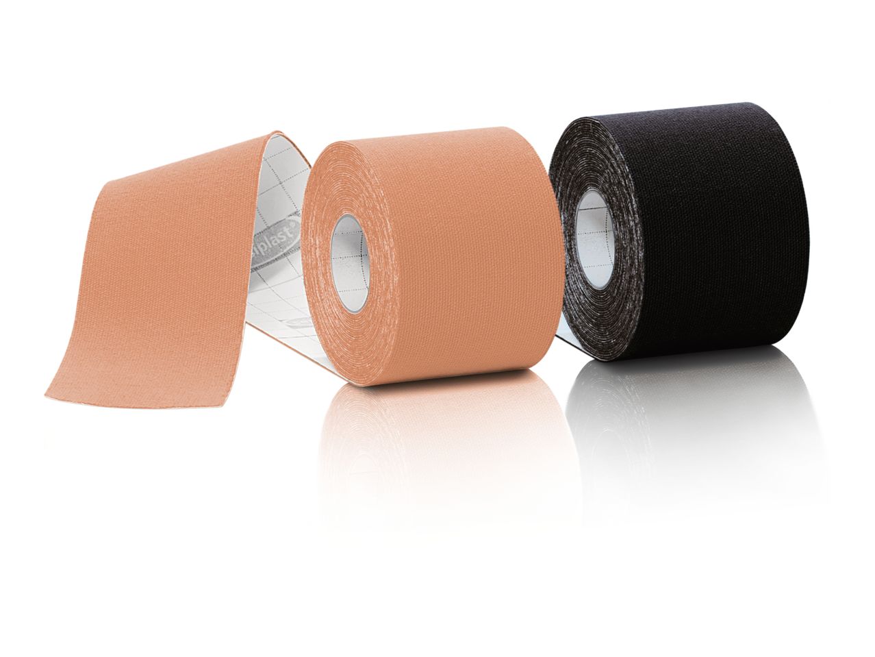 Three rolls of kinesiology tape, two beige and one black, with reflections.