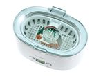 An ultrasonic cleaner with a digital display, containing a watch submerged in water.