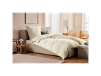 Light green muslin bedding in a minimalist bedroom.