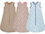 Tre babysovpåsar: en randig beige, en blommig rosa och en prickig ljusblå.