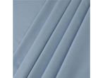 Close-up of light blue fabric with soft, diagonal folds.