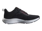 Black and grey athletic shoe with orange accents, side view.