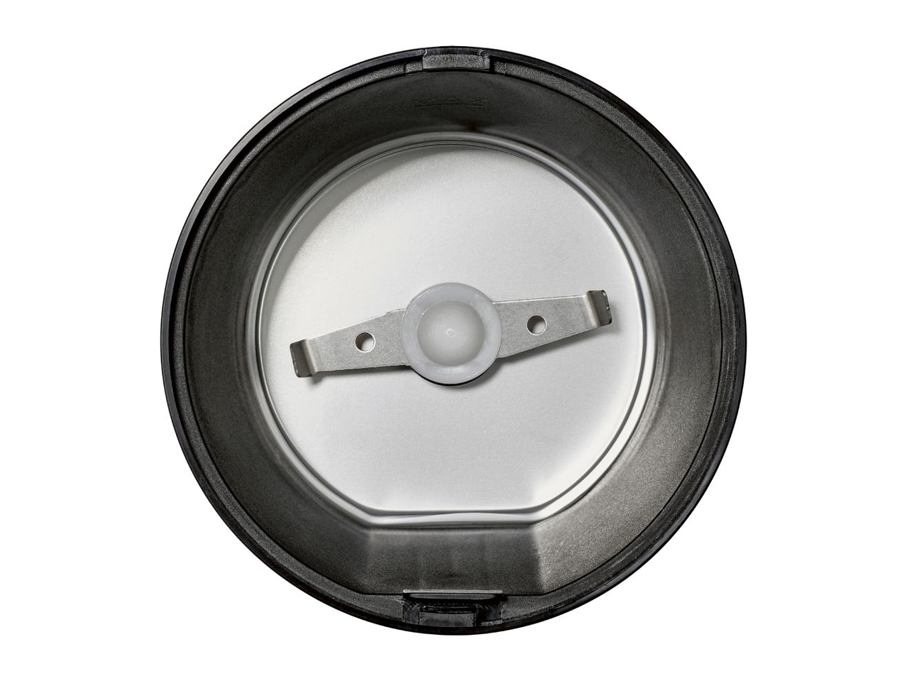 Top-down view of an empty coffee grinder with a two-blade grinding mechanism.