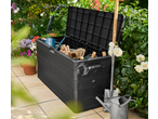 Livarno Garden Storage Box filled with gardening tools on a patio surrounded by flowers