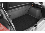Car trunk with a black, textured rubber mat.