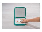 A person wiping colorful drawings off a reusable drawing board with a cloth.
