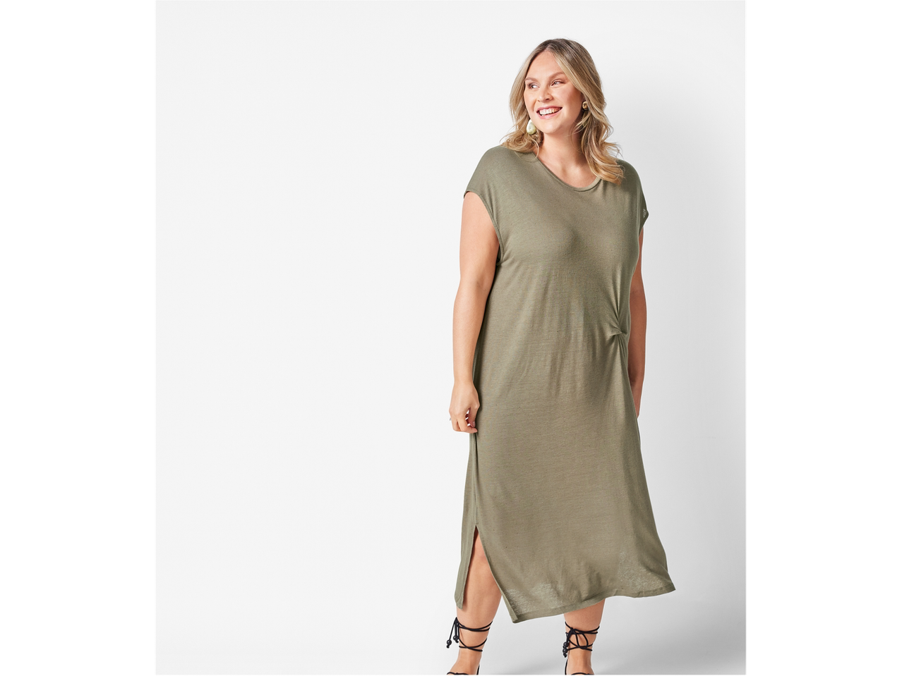 Zelena midi obleka z stranskimi režami.