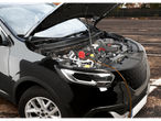 ULTIMATE SPEED oil pump UOP 12 C1 in a car with an open hood.