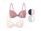 Due reggiseni push-up, uno rosa e uno beige, con campioni di colore nero, beige, verde menta e bianco.