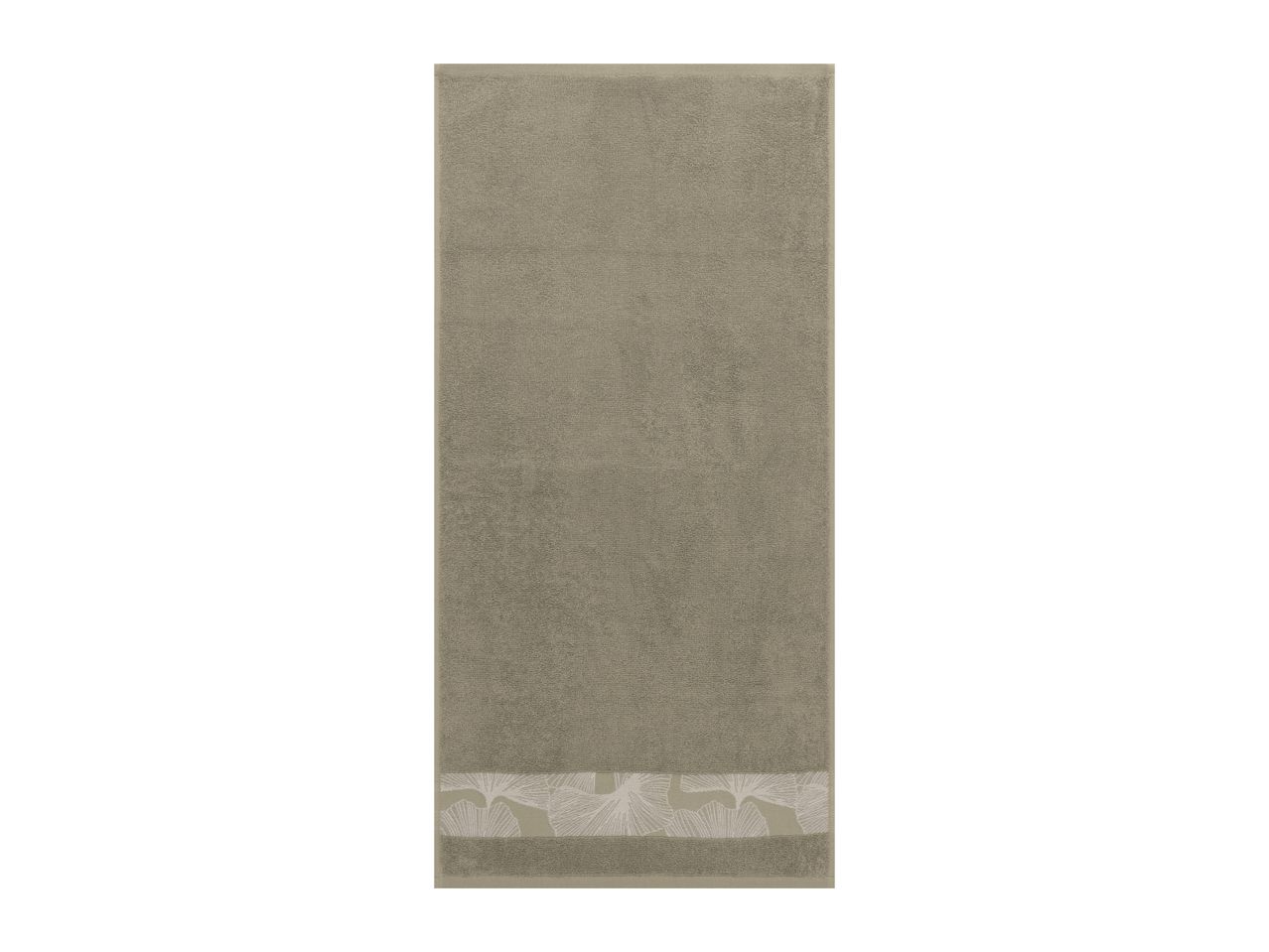A beige towel with a decorative band featuring a subtle leaf pattern at the bottom.